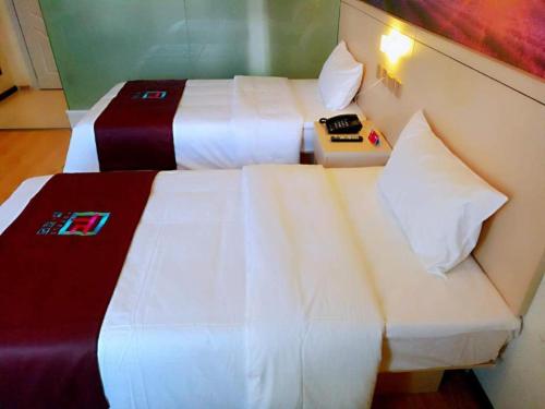 Katil atau katil-katil dalam bilik di PAI Hotels·Urumqi South Gate Xinhua Bookstore