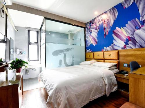 Ένα ή περισσότερα κρεβάτια σε δωμάτιο στο PAI Hotel·Linfen Hongdong Lily Town