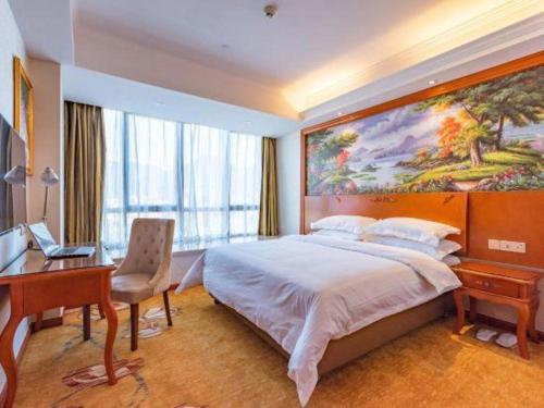 Vienna Hotel Fujian Quanzhou Anxi County Baolong Square 객실 침대