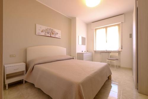 Un pat sau paturi într-o cameră la Orchidea Luxury - Pineto Vacanza