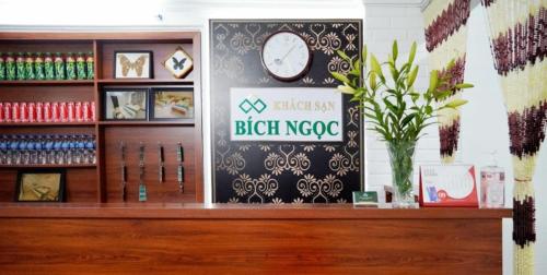 a store with a clock on a wall at Bích Ngọc Hotel Hà Nội in Hanoi