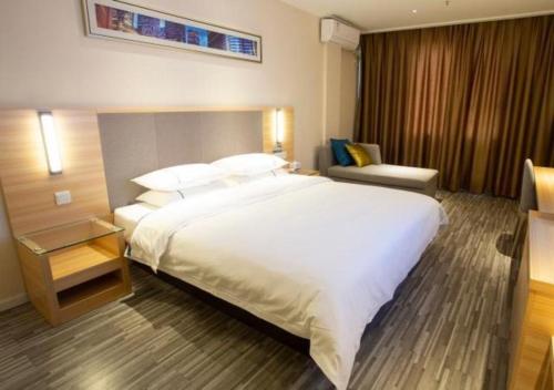Gulta vai gultas numurā naktsmītnē City Comfort Inn Huanggang Tuanfeng Passenger