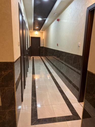 a hallway with a bowling alley in a building at Star building in Khor Fakkan