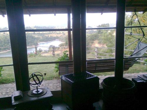 a room with a large window with a view at Cabañas Quillay Viejo in Lago Rapel