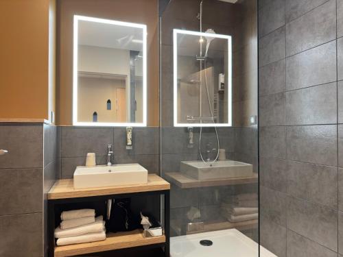 a bathroom with a sink and a mirror at Best Western Hotel Coeur de Maurienne in Saint-Jean-de-Maurienne