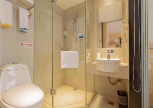 a bathroom with a toilet and a sink at City Comfort Inn Liuzhou Wuxing Walking Street in Liuzhou