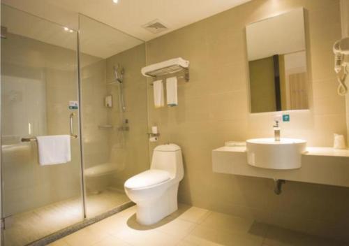 a bathroom with a toilet and a sink and a shower at City Comfort Inn Zhanjiang South Railway Station in Zhanjiang
