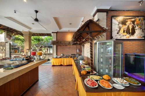 a kitchen with plates of food on a counter at Legian Village Beach Resort - CHSE Certified in Legian