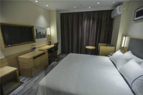 Giường trong phòng chung tại City Comfort Inn Hefei Anhui Medical University Affiliated Hospital USTC