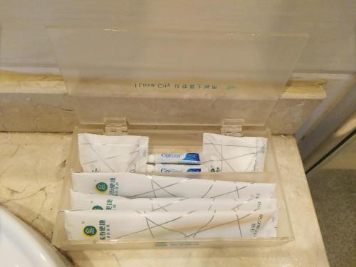 a display of toothbrushes in a box in a store at City Comfort Inn Hangzhou Xingqiao Bei Road in Yuhang