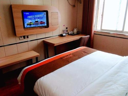 Jun Hotel Anhui Bozhou Lixin County Wenzhou Road tesisinde bir odada yatak veya yataklar