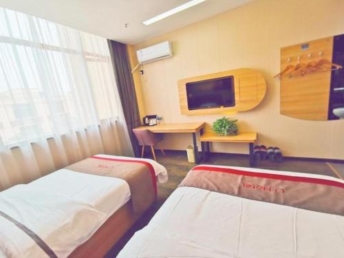Katil atau katil-katil dalam bilik di Thank Inn Hotel Jiangsu Wuxi Jiangyin District Ligang Street Xinggang Road