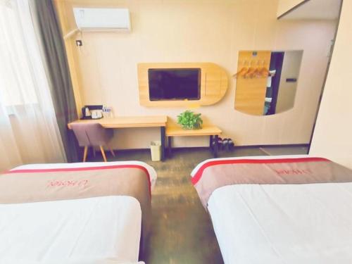 Katil atau katil-katil dalam bilik di Thank Inn Hotel Jiangsu Wuxi Jiangyin District Ligang Street Xinggang Road