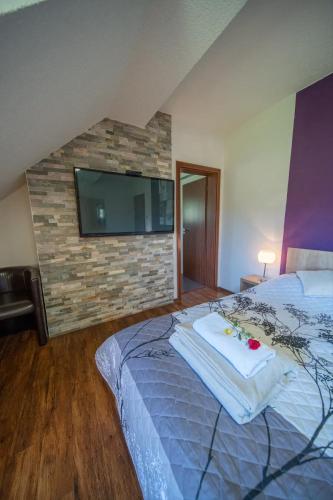 Postel nebo postele na pokoji v ubytování Wellness Penzion Life