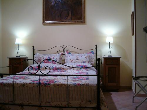 A bed or beds in a room at B&b La Giara