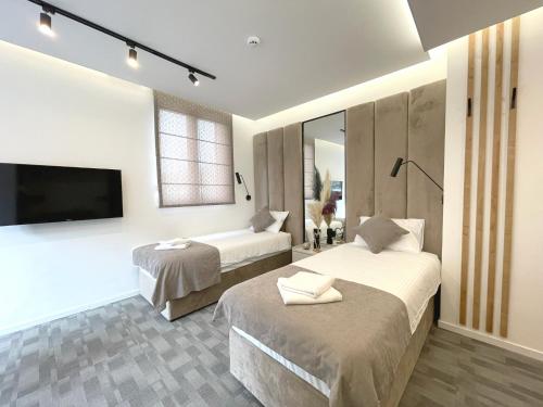 Postel nebo postele na pokoji v ubytování Hotel NPL CODE