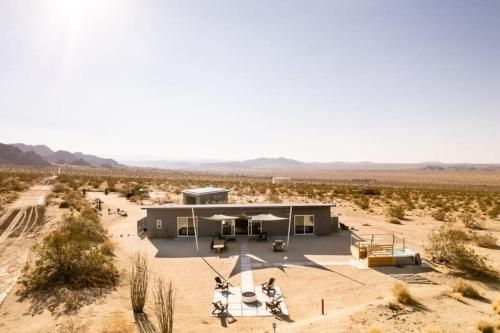 a building in the middle of the desert at Joshua Tree Luxury Home With Hot Tub & views in Joshua Tree