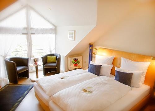 Кровать или кровати в номере Auehof Hotel & Restaurant