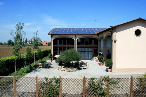 a house with a solar array on top of it at Agriturismo Argaland in Parma