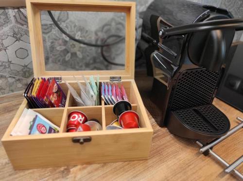 a wooden box with a mirror on a desk at Lawendowy - Apartamenty Smart Projekt in Tarnów