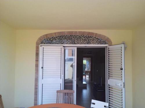 a room with an open door with a table and chairs at Miramar in Almazora