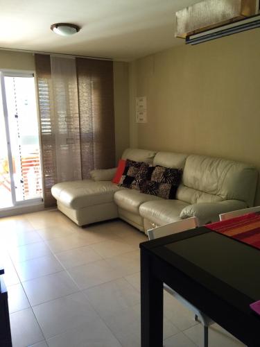 a living room with a couch and a table at Miramar in Almazora