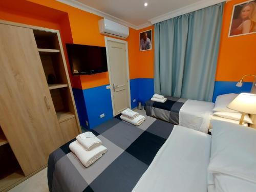 Postel nebo postele na pokoji v ubytování Hotel Positano