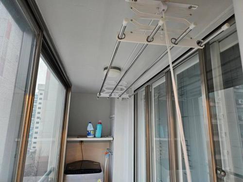 a room with a window and a ceiling at BA Stay in Suwon