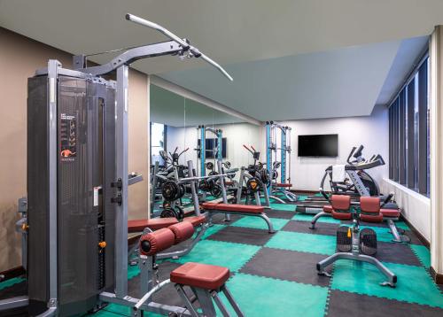 a gym with a bunch of bikes in a room at Best Western Plus Tabuk City Center in Tabuk
