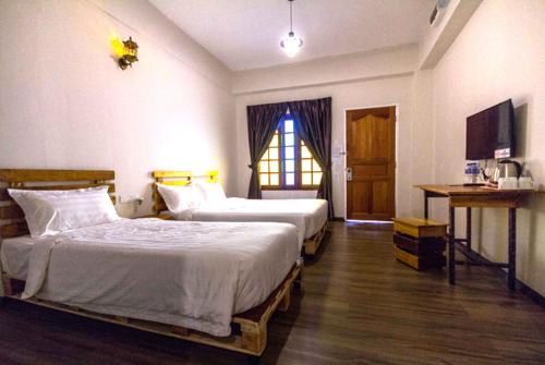 Ένα ή περισσότερα κρεβάτια σε δωμάτιο στο Kea Garden Guest House