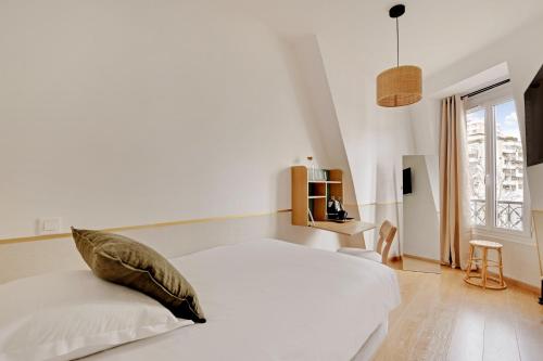 Ένα ή περισσότερα κρεβάτια σε δωμάτιο στο Maison Urbaine