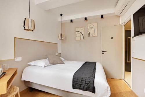 Ένα ή περισσότερα κρεβάτια σε δωμάτιο στο Maison Urbaine
