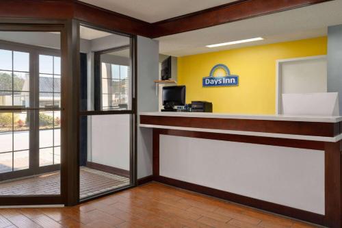 a lobby with a dixon sign on the wall at Days Inn by Wyndham Dillon in Dillon