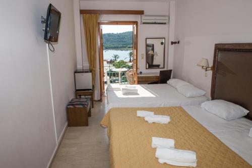 Postel nebo postele na pokoji v ubytování Verdelis Inn
