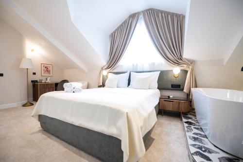 Postel nebo postele na pokoji v ubytování Boem Exclusive Rooms Skadarlija