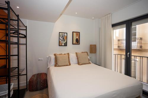 Postel nebo postele na pokoji v ubytování Apartamentos 7 dreams