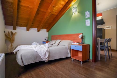 a bedroom with a bed and a table with a lamp at Bnbook Expo Residence Rho in Rho