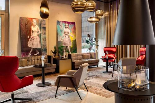 a lobby with chairs and a couch and a table at Amedia Lustenau, Trademark Collection by Wyndham in Lustenau