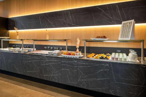 a buffet line with many different types of food at Amedia Lustenau, Trademark Collection by Wyndham in Lustenau