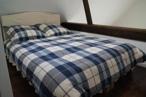 מיטה או מיטות בחדר ב-Le Gîte De Malaunay