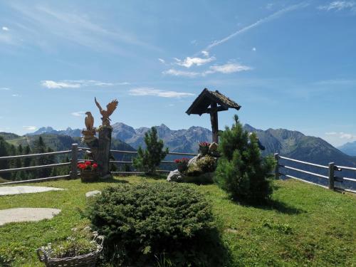 a garden with a view of the mountains at Wellness Aparthotel Panorama Alpin - Ferienwohnungen Jerzens im Pitztal in Jerzens