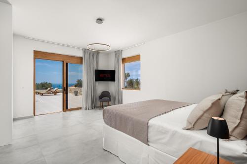 Ένα ή περισσότερα κρεβάτια σε δωμάτιο στο Delfini Villas 1, 2, 3, 4, 5, 6 - Kalamaki