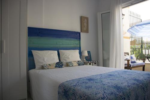 מיטה או מיטות בחדר ב-La Casa De La Playa