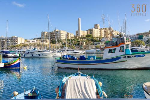 a group of boats are docked in a harbor at Spacious 2BR home with Large, Private Sun Terrace by 360 Estates in Taʼ Xbiex