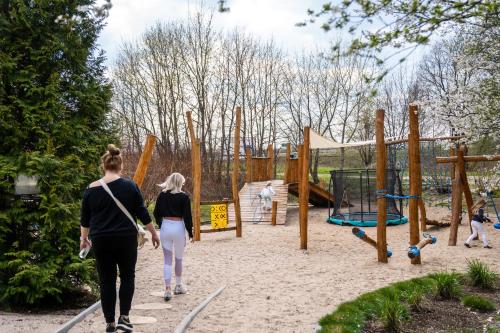 two people walking through a playground at Hotel Azzun Orient SPA&Wellness in Kromerowo
