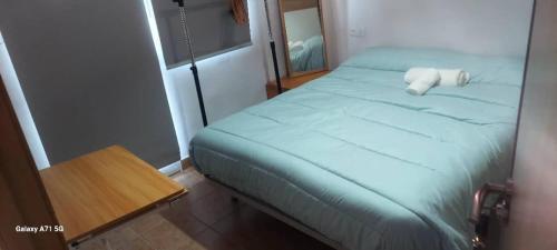 Ένα ή περισσότερα κρεβάτια σε δωμάτιο στο Apartamento San Juan