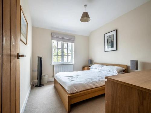 a bedroom with two beds and a window at Spacious modern home in picturesque village in Exeter