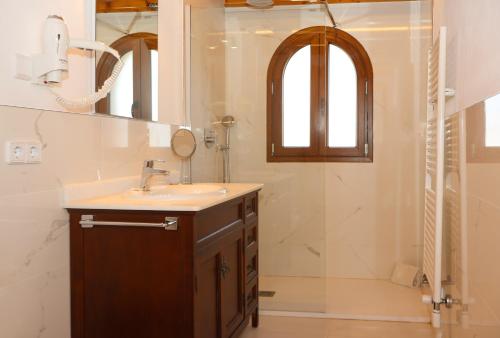 a bathroom with a sink and a shower at 041 Finca Can Roig Gran ET0309 by Mallorca Charme in Pollença