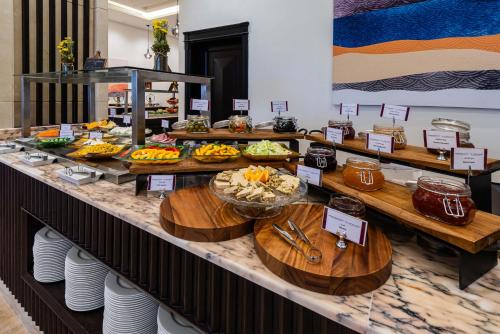 a buffet line with many different types of food at Best Western Plus Tabuk City Center in Tabuk