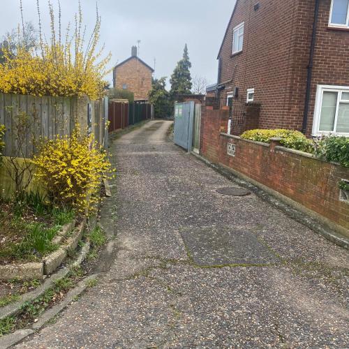 an empty street in front of a house at Garage for rent as storage or keep your car, none suitable for living in Stanwell